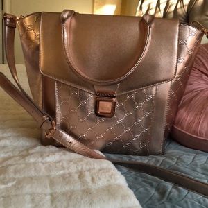 BeBe Metallic Rose Gold Handbag large size . NWOT, never used.